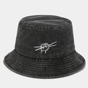 Detail of washed charcoal bucket hat featuring white hand gesture embroidery and metal eyelets