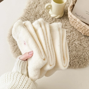 Thick white winter plush socks with warm thermal fleece lining and soft embroidery details