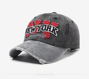 Close-up of vintage washed grey baseball cap with NY embroidery and distressed brim details