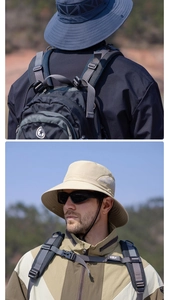Detail of breathable wide brim sun hat and professional hiking backpack for outdoor activities