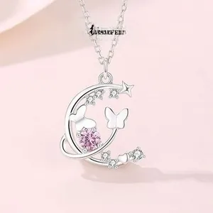 Macro view of S925 silver necklace featuring a moon pendant with pink zircon and butterfly
