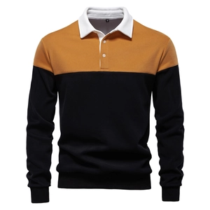 Detail of color-block polo sweatshirt featuring yellow, black, and white patchwork design