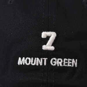 Detail of white 3D embroidery with number 7 and Mount Green text on black cotton cap