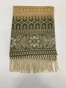 Close-up of ethnic stripe cashmere-feel scarf with geometric patterns and fringe detail