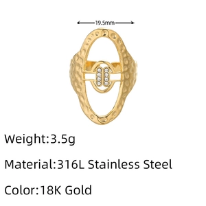 Detail of 18K gold stainless steel ring with hollow design and brushed hammered texture
