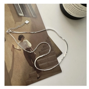 Detailed close-up of S925 sterling silver chain with adjustable extender and square tag