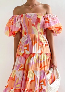 Detail of floral off-shoulder maxi dress with puff sleeves and smocked bodice design