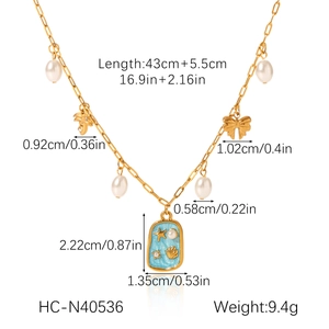 Detail view of gold starfish and shell necklace showing 43cm length and 9.4g weight specs