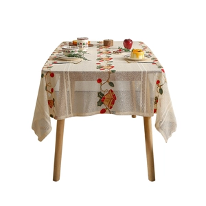 Modern American Christmas tablecloth with lace embroidery of bells and holly on cream fabric