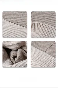 Detail shot of the beige ribbed knit texture and thick cuff stitching on the winter beanie