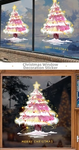 Detailed view of pink Christmas tree window stickers with Merry Christmas gold lettering