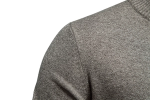 Close-up of grey knit cardigan shoulder seam showing premium fabric texture and stitching