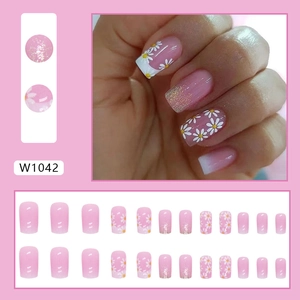 French gradient press-on nails with white daisy floral patterns and glitter finish