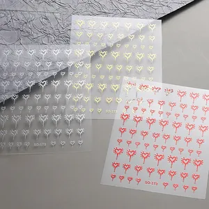 Macro view of SO-173 nail art stickers featuring gold silver and red liquid heart designs