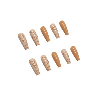 Long coffin fake nails in beige and orange with heart pattern and rhinestones