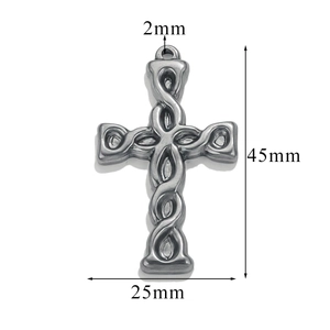 Macro detail of silver cross pendant with twisted texture and dimension markings