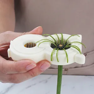 Manual stainless steel green onion slicer for uniform vegetable shredding in kitchen