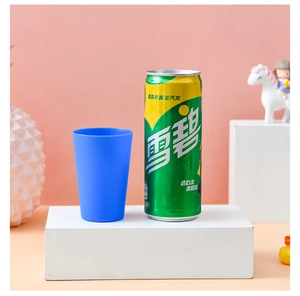 Blue matte plastic stacking cup shown next to a 330ml soda can for size reference