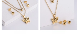 Close-up of double-layered gold butterfly pendant necklace and round bead earrings set