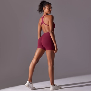 Macro shot of backless design and seamless red fabric on professional yoga bodysuit