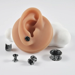 White ink splash pattern black silicone flesh tunnels shown on ear models