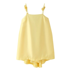 Pale yellow satin slip dress featuring 3D floral accents and tiered ruffled hemline