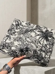 Detailed close-up of tiger and jungle embroidery on a high-quality canvas tote bag