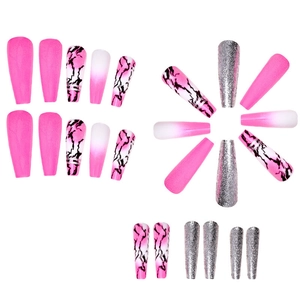 Macro detail of long coffin press-on nails in pink gradient, marble, and silver glitter