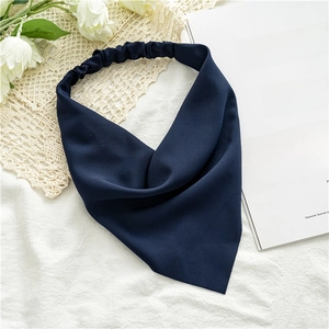 Close-up of deep blue chiffon hair kerchief with elastic band and soft fabric texture