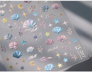 Macro view of TL-207 seashell nail stickers with iridescent 3D texture and ocean motifs