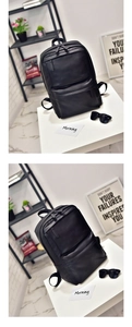 Minimalist black leather backpack for men with front zipper pocket in lifestyle setting
