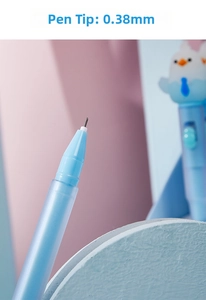 Macro shot of 0.38mm needle tip and cute bird topper on light blue novelty glowing pen
