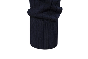 Detail shot of navy blue sweater ribbed cuffs showing high-quality knit texture