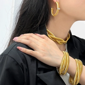 Elegant gold multi-strand choker necklace and matching spiral earring set for women