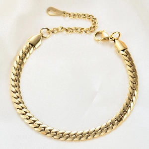 6mm gold-plated stainless steel Cuban link bracelet on white silk with lobster clasp