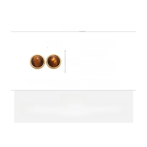 Detail view of 22mm tiger eye stud earrings with gold plating and silver needles