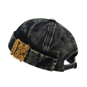 Vintage washed denim docker hat with side patch and adjustable metal buckle