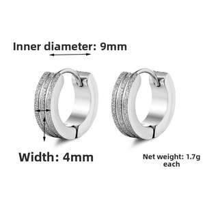 Macro detail of 4x9mm frosted silver huggie earrings showing dimensions and weight