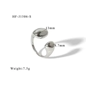 Macro detail of silver irregular pebble-shaped open ring showing dimensions 13mm and 8.7mm