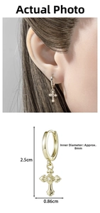 Detail view of gold cross earring with size dimensions 2.5cm length and 8mm diameter