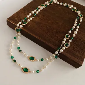 Vintage multi-layer pearl necklace with emerald green gemstones and gold trim