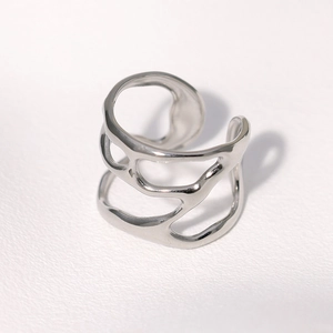 Irregular hollow open ring in polished stainless steel with minimalist aesthetic