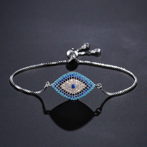Detailed close-up of Evil Eye slider bracelet with sparkling blue and white crystals
