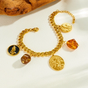 Vintage gold-plated stainless steel chain bracelet with amber beads and religious relief charms