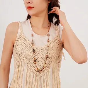 Bohemian glass ceramic butterfly beaded long necklace worn on white knit sweater