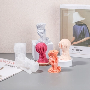 Detailed view of Halloween ghost hand silicone molds with rose and skull candle shapes