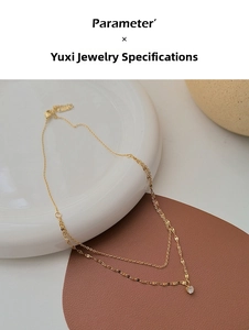Close-up of double-layer titanium necklace with sparkling crystal pendant and lobster clasp
