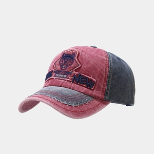 Close-up of vintage washed cotton baseball cap with husky patch and embroidery details
