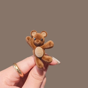 Cute brown flocked teddy bear hair clip with waving pose for girls and women