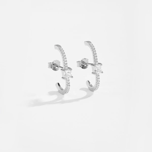 Macro shot of S925 sterling silver C-shaped stud earrings with micro-pave cubic zirconia